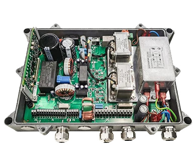 Image of an open high-reliability power supply specifically for marine applications, securely housed in an IP67-certified enclosure to protect against dust and water. The power supply utilizes advanced power electronics that are mounted using both SMD and THT assembly techniques. The product is realized as complete box building and undergoes a 100% functional test of all circuit boards and the entire device.