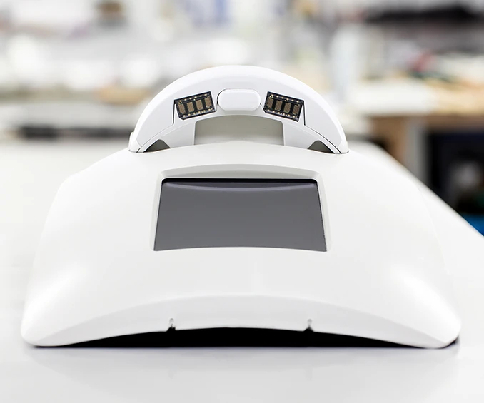 Image of an example of an integrated charging station, housed in a white plastic enclosure with a built-in TFT display. This example demonstrates the capabilities of CLOOS electronic in complex box building and conducting 100% functional tests, ensuring reliability and the highest quality in final product manufacturing.