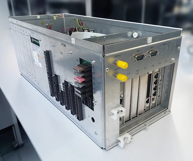Image showing the integration of electronic cards into a custom sheet metal enclosure, forming an industrial PC with specific measurement cards. This example illustrates the extensive box building capabilities of CLOOS electronic, providing tailored solutions for complex requirements.