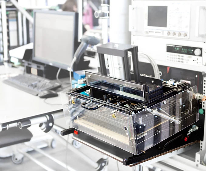 Image of a nail board adapter on an automatic test system, used for performing functional tests, in-circuit tests, and firmware programming on an electronic card. This process ensures full traceability and guarantees that the electronic cards are 100% functional when delivered to the customer.