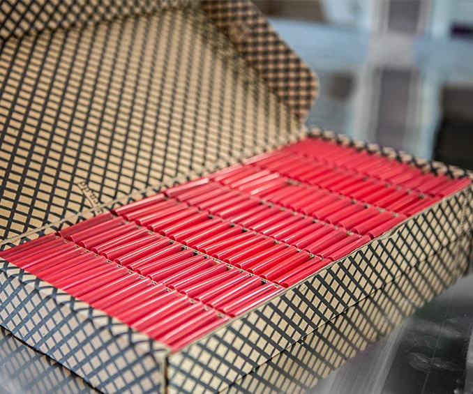 Photo of ESD cardboard and film separators from CLOOS electronic, specifically designed for the safe transportation of small electronic boards. These packaging solutions provide optimal protection against electrostatic discharge and are ideal for international delivery, ensuring the integrity of electronics during logistics.